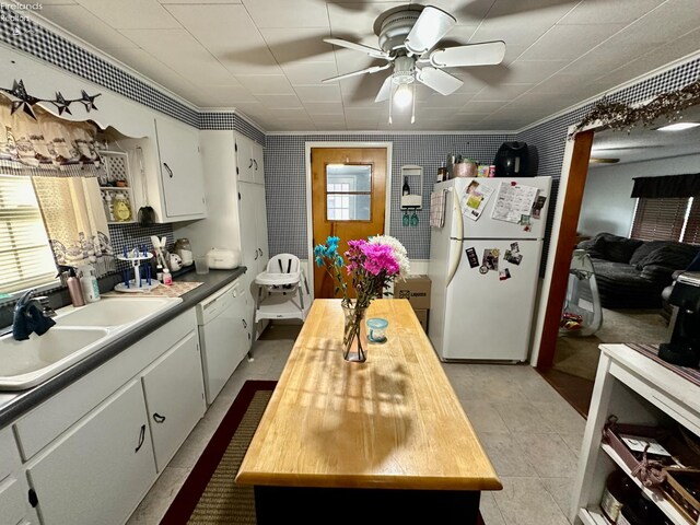 203 Washington St, Bettsville, OH 44815 - kitchen featuring white appliances, butcher block countertops, a sink, a ceiling fan, and white cabinetry