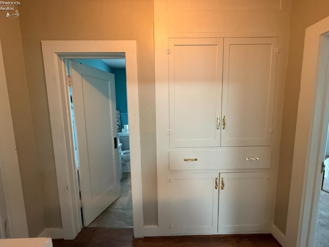 118 E 5th St, Port Clinton, OH 43452 - corridor featuring dark wood-style flooring and baseboards