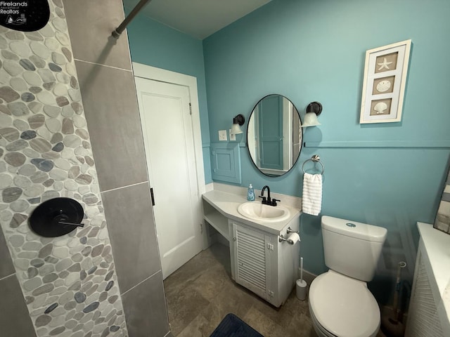 118 E 5th St, Port Clinton, OH 43452 - bathroom featuring toilet, a shower, and vanity