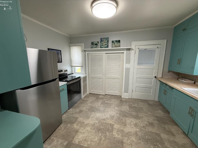 118 E 5th St, Port Clinton, OH 43452 - kitchen with green cabinetry, stainless steel appliances, light countertops, ornamental molding, and stone finish floors