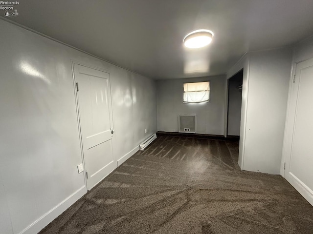 118 E 5th St, Port Clinton, OH 43452 - unfurnished bedroom featuring carpet, baseboards, and a baseboard radiator