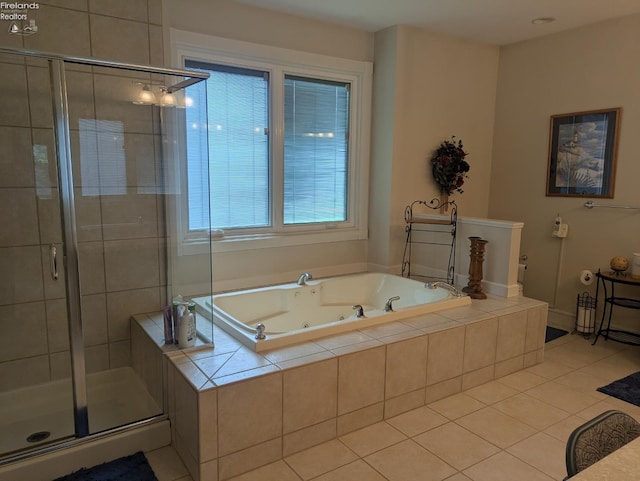 508 Snowy Egret Dr, Huron, OH 44839 - bathroom featuring a stall shower, a tub with jets, and tile patterned floors