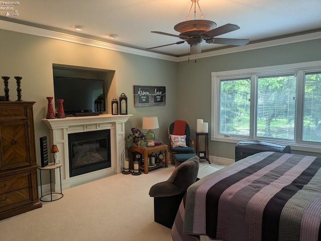 508 Snowy Egret Dr, Huron, OH 44839 - bedroom with crown molding, carpet flooring, a glass covered fireplace, and a ceiling fan