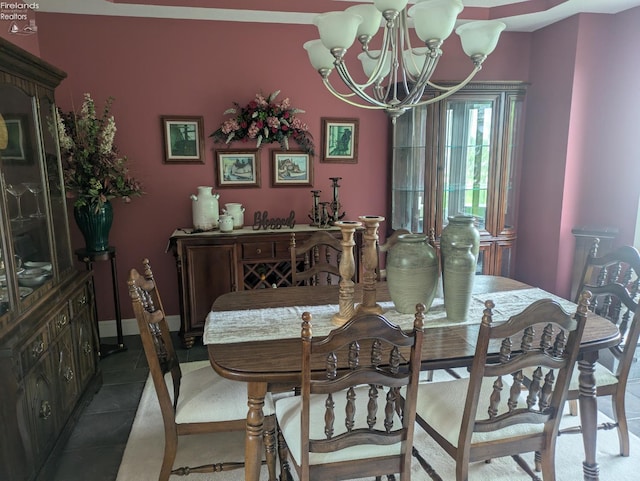 508 Snowy Egret Dr, Huron, OH 44839 - tiled dining room featuring a chandelier