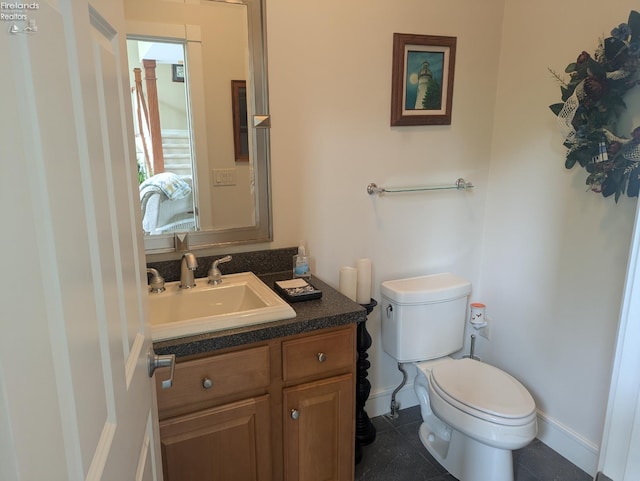 508 Snowy Egret Dr, Huron, OH 44839 - bathroom with toilet, vanity, baseboards, and tile patterned flooring
