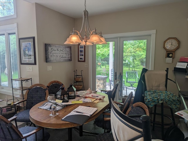 508 Snowy Egret Dr, Huron, OH 44839 - dining space with french doors, healthy amount of natural light, and a chandelier