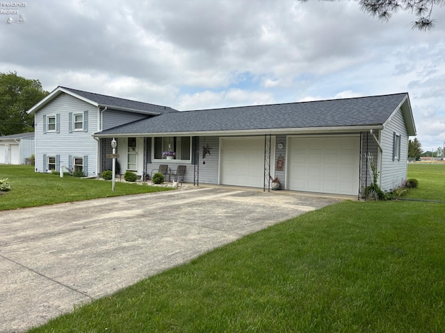 87 E Township Road 143, Tiffin, OH 44883 - split level home featuring a front lawn, a garage, driveway, and a shingled roof