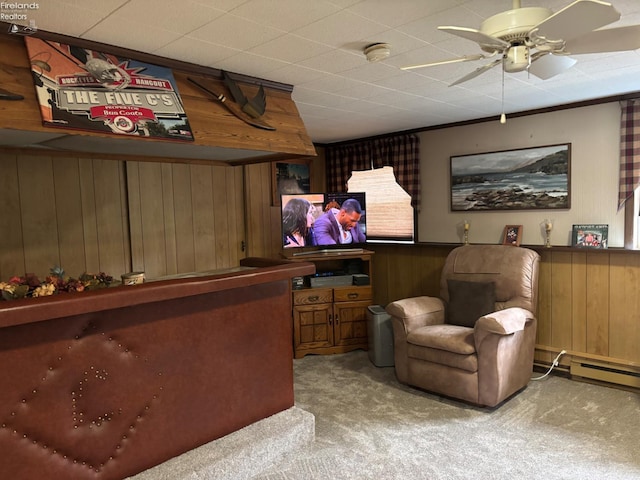 87 E Township Road 143, Tiffin, OH 44883 - bar with wood walls, carpet flooring, ceiling fan, and a baseboard radiator