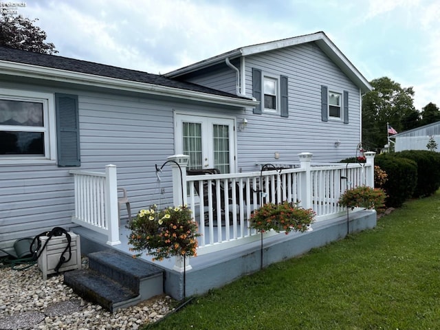 87 E Township Road 143, Tiffin, OH 44883 - rear view of house with a wooden deck and a yard