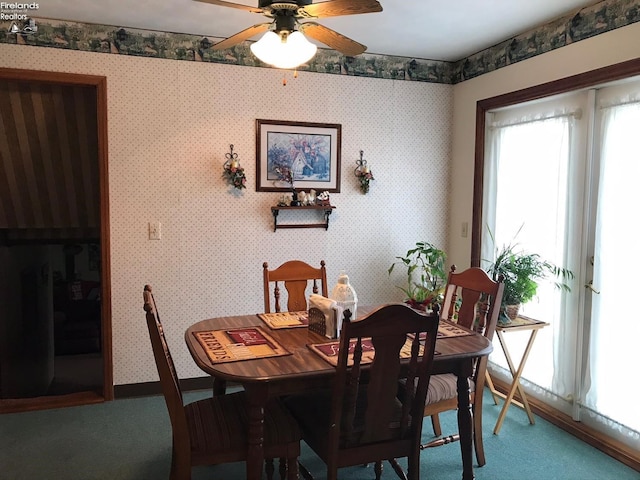 87 E Township Road 143, Tiffin, OH 44883 - carpeted dining area with ceiling fan and baseboards