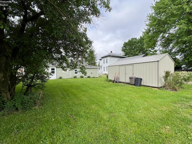 90 Newton St, Norwalk, OH 44857 - view of green lawn with an outbuilding