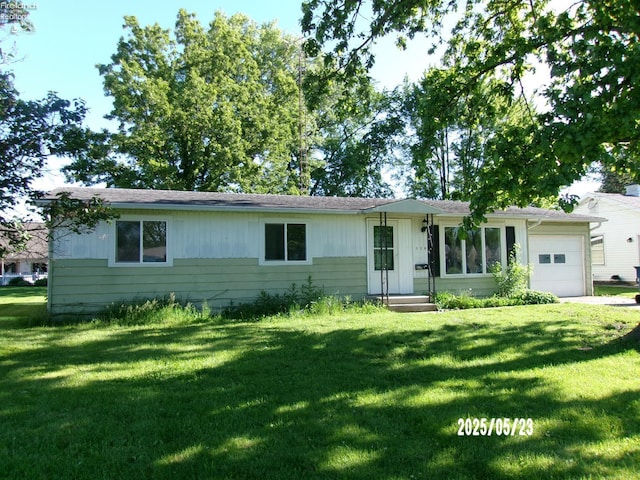 126 E Ottawa St, Oak Harbor, OH 43449 - ranch-style house with an attached garage and a front lawn