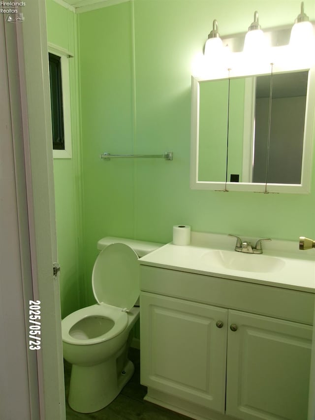 126 E Ottawa St, Oak Harbor, OH 43449 - bathroom featuring vanity and toilet