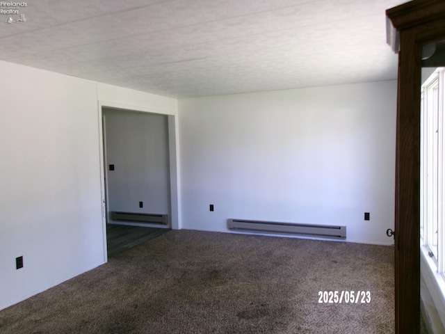 126 E Ottawa St, Oak Harbor, OH 43449 - spare room featuring a baseboard radiator and carpet