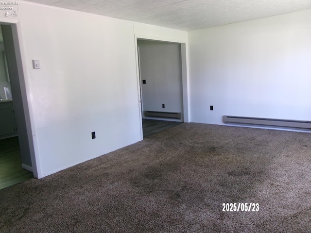 126 E Ottawa St, Oak Harbor, OH 43449 - carpeted spare room featuring a baseboard heating unit
