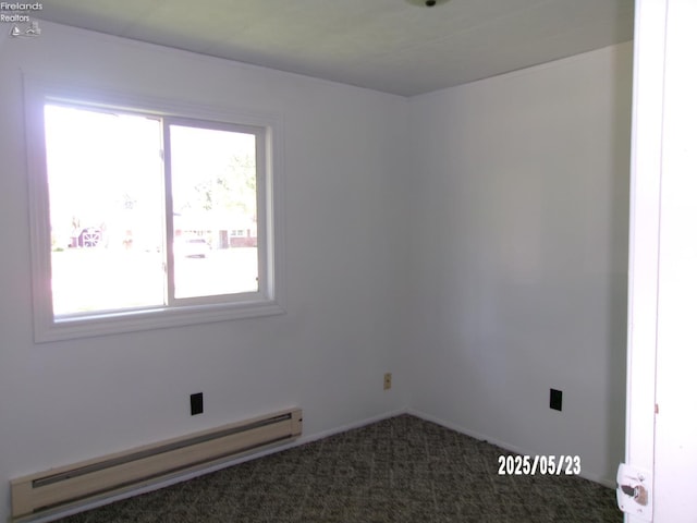 126 E Ottawa St, Oak Harbor, OH 43449 - spare room featuring a baseboard heating unit, carpet flooring, and baseboards