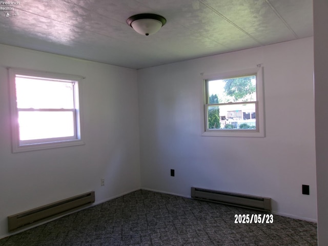 126 E Ottawa St, Oak Harbor, OH 43449 - carpeted spare room with baseboard heating and baseboards