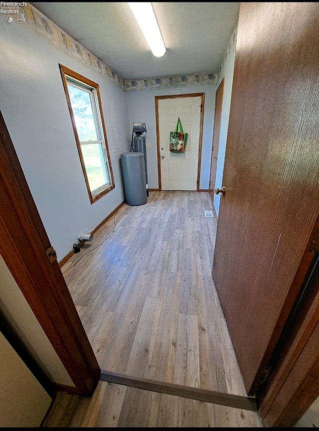 5890 E Sr 18, Republic, OH 44867 - laundry area with light wood finished floors and baseboards