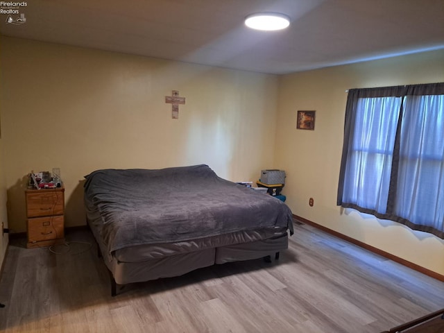 5890 E Sr 18, Republic, OH 44867 - bedroom with wood finished floors and baseboards