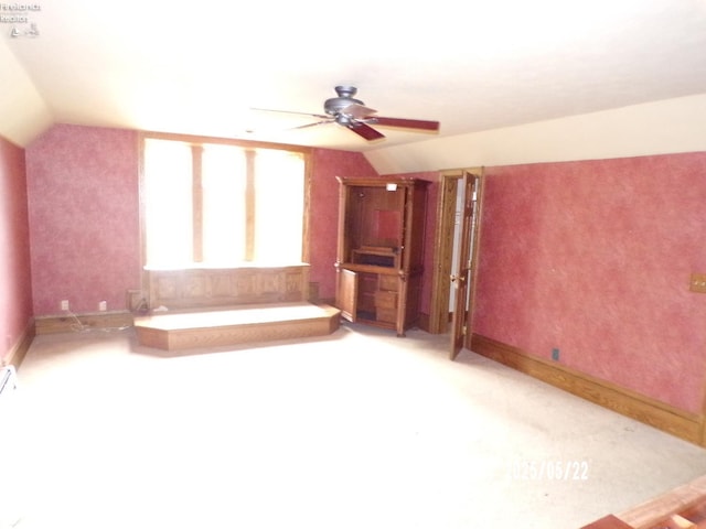 408 W Main St, Bellevue, OH 44811 - bathroom with vaulted ceiling, ceiling fan, a tub, and baseboards