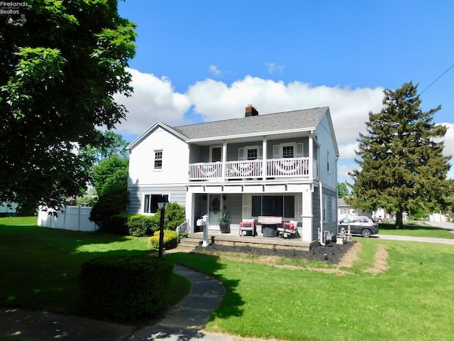 200 Lawrence St, Bellevue, OH 44847 - rear view of house featuring a balcony and a chimney