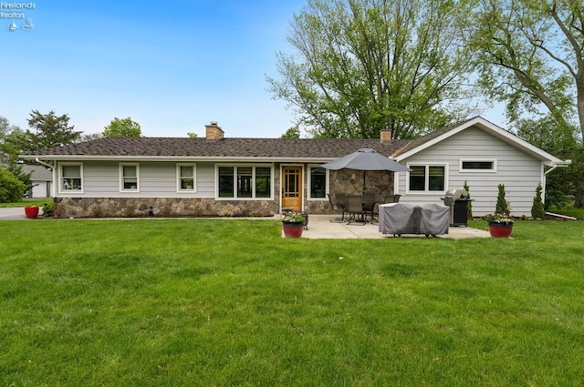 3999 NE Catawba Rd Unit 29, Port Clinton, OH 43452 - back of house with a chimney, a patio area, a yard, and stone siding