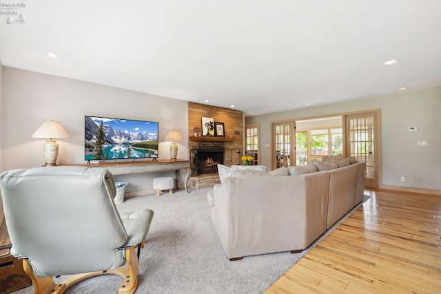 3999 NE Catawba Rd Unit 29, Port Clinton, OH 43452 - living room with a fireplace, wood finished floors, recessed lighting, and baseboards