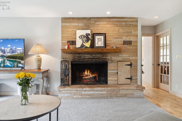 3999 NE Catawba Rd Unit 29, Port Clinton, OH 43452 - living room with wood finished floors, a fireplace, and recessed lighting