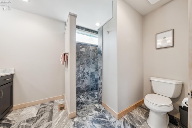 3999 NE Catawba Rd Unit 29, Port Clinton, OH 43452 - bathroom with a walk in shower, toilet, vanity, and baseboards