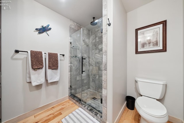 3999 NE Catawba Rd Unit 29, Port Clinton, OH 43452 - bathroom with a stall shower, wood finished floors, and toilet