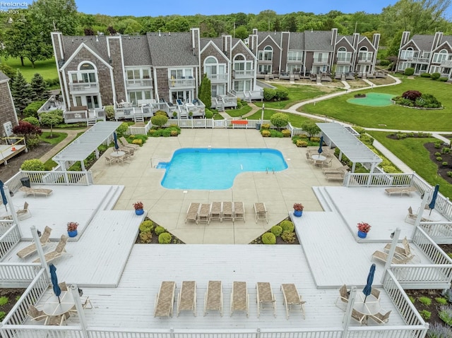 3999 NE Catawba Rd Unit 29, Port Clinton, OH 43452 - community pool with a residential view, a wooden deck, and a patio area