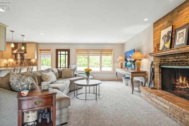 3999 NE Catawba Rd Unit 29, Port Clinton, OH 43452 - living area featuring carpet flooring, a fireplace, recessed lighting, and baseboards