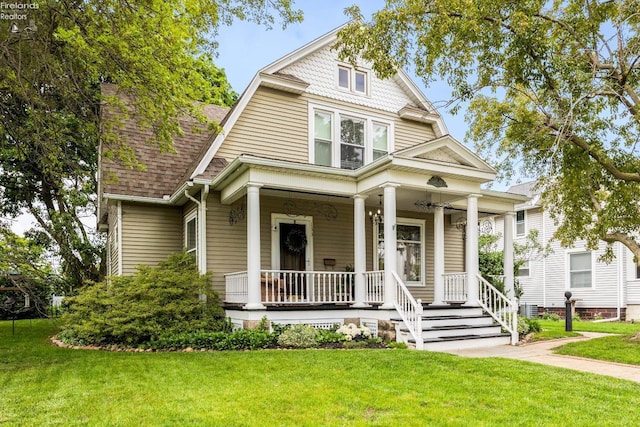 133 E Forest St, Clyde, OH 43410 - view of front of home featuring a porch, a front yard, and roof with shingles