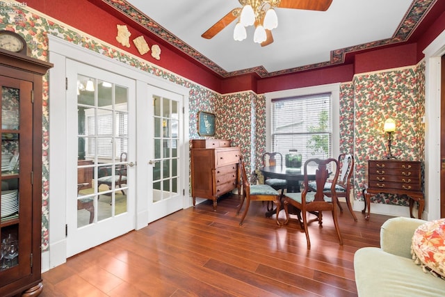 133 E Forest St, Clyde, OH 43410 - dining space with wallpapered walls, ceiling fan, wood finished floors, and french doors
