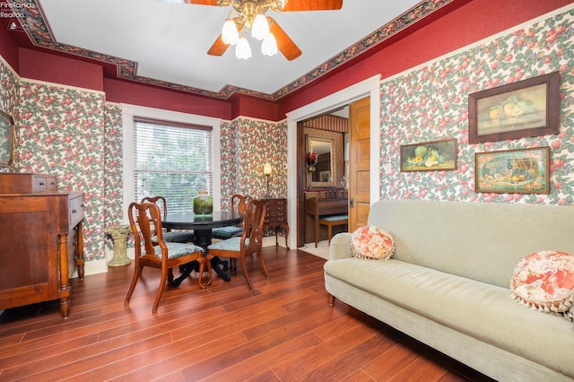 133 E Forest St, Clyde, OH 43410 - dining area with wallpapered walls, wood finished floors, and a ceiling fan