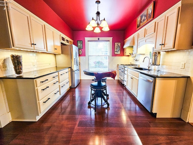 133 E Forest St, Clyde, OH 43410 - kitchen featuring stainless steel appliances, a sink, dark countertops, a chandelier, and tasteful backsplash