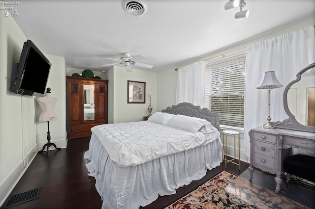 133 E Forest St, Clyde, OH 43410 - bedroom with dark wood finished floors, baseboards, and a ceiling fan