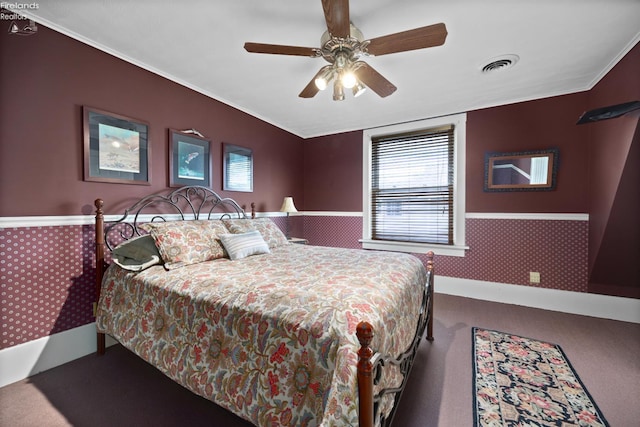133 E Forest St, Clyde, OH 43410 - carpeted bedroom with wainscoting, wallpapered walls, ornamental molding, and ceiling fan