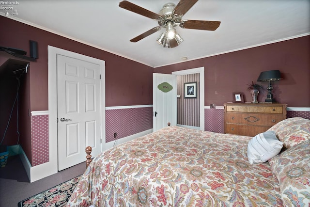 133 E Forest St, Clyde, OH 43410 - carpeted bedroom with wainscoting, crown molding, and ceiling fan