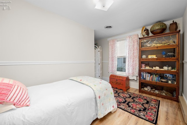 133 E Forest St, Clyde, OH 43410 - bedroom with wood finished floors and baseboards