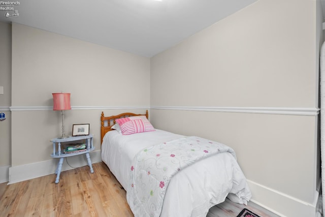 133 E Forest St, Clyde, OH 43410 - bedroom featuring wood finished floors and baseboards