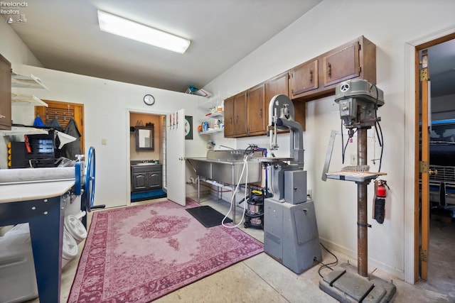 133 E Forest St, Clyde, OH 43410 - kitchen featuring concrete floors, open shelves, and a sink