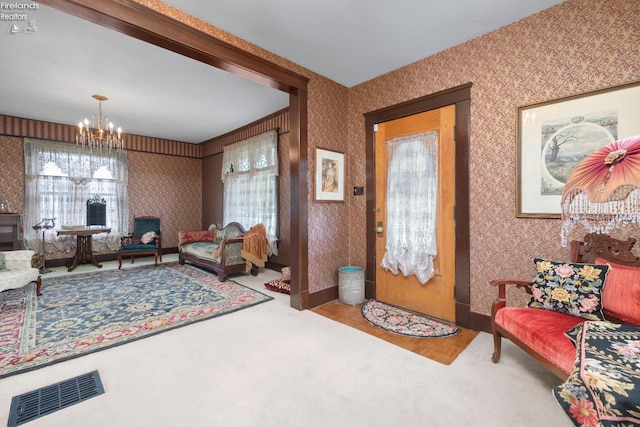 133 E Forest St, Clyde, OH 43410 - carpeted foyer with plenty of natural light, a chandelier, and wallpapered walls