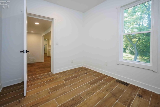 612 2nd St, Fremont, OH 43420 - unfurnished room featuring dark wood finished floors, healthy amount of natural light, and baseboards