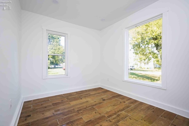 612 2nd St, Fremont, OH 43420 - spare room with dark wood-style floors and baseboards