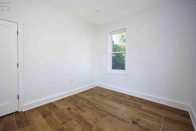 612 2nd St, Fremont, OH 43420 - spare room with dark wood-style floors and baseboards