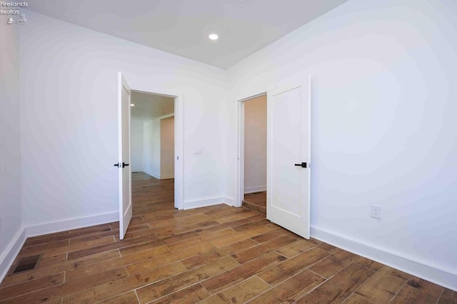 612 2nd St, Fremont, OH 43420 - spare room featuring wood finished floors, baseboards, and recessed lighting