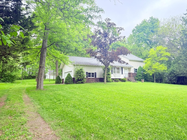 9343 E Bayshore Rd, Marblehead, OH 43440 - view of front of property featuring a front yard and an attached garage