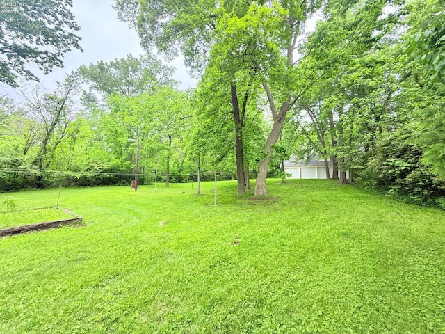 9343 E Bayshore Rd, Marblehead, OH 43440 - view of grassy yard with a garage