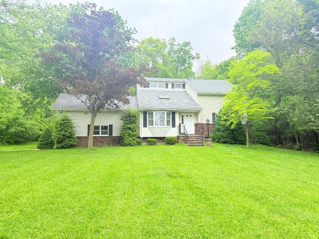 9343 E Bayshore Rd, Marblehead, OH 43440 - view of front of property featuring a front yard and roof with shingles